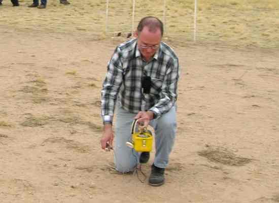 Using a geiger counter at Trinity Site Ground Zero