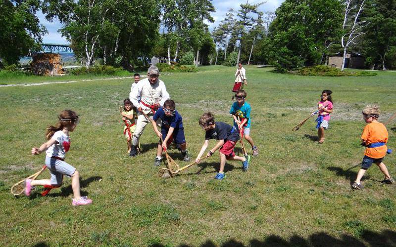Children playing bagataway at Fort Michilimackinac