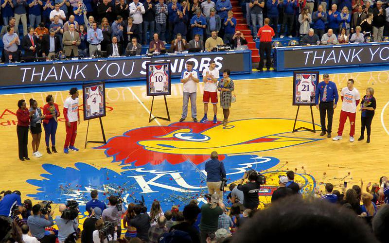 KU Seniors Devont Graham, Clay Young, Sviatoslav Mykhailiuk and families