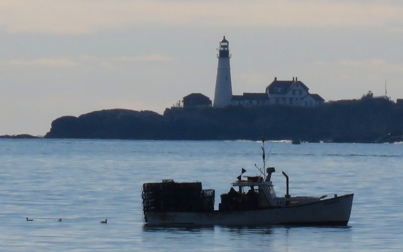 Portland Head Lighthouse and lobster fishing boat Nomad