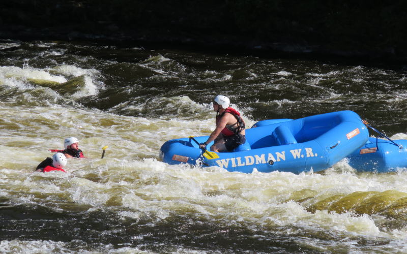 White water faft with one passenger remaining out of four