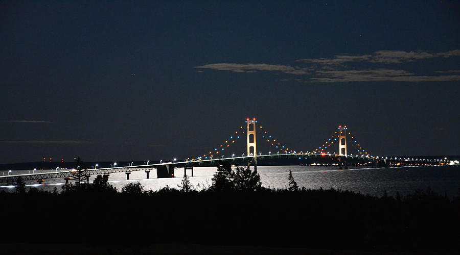 Mackinac Bridge with moon backlighting
