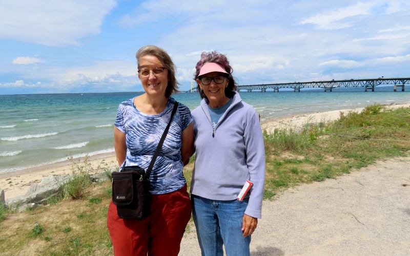 Linda Stokes and Peggy Rose with the Mackinac Bridge