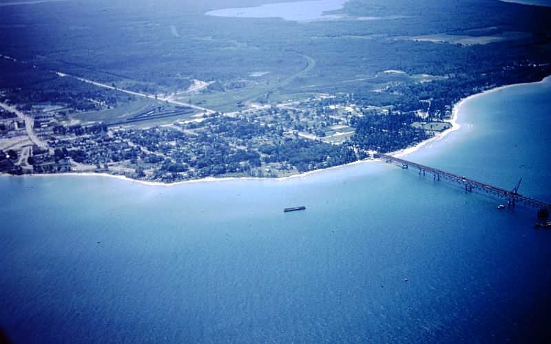 Mackinaw City from the air during the building of the Mackinac Bridge