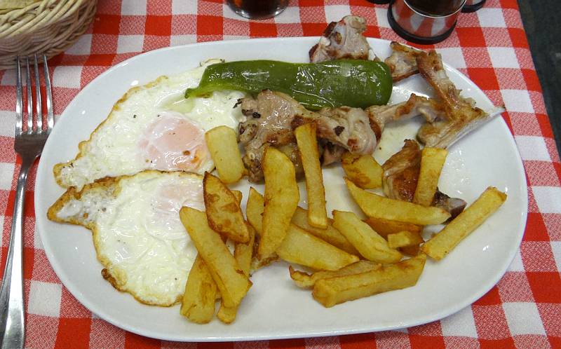 fried eggs, lamb chops nd French fried potatoes