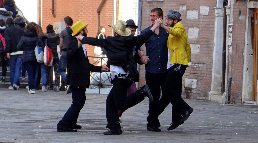 Jewish men dancing and singing for Purim