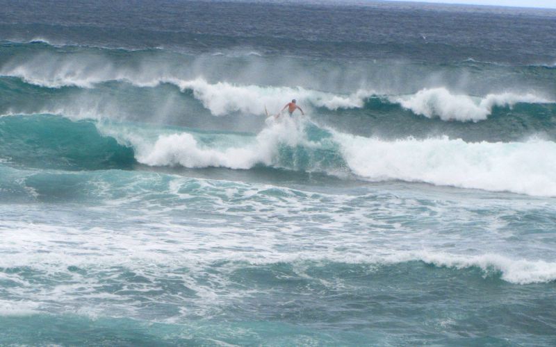 Surfer with large waves