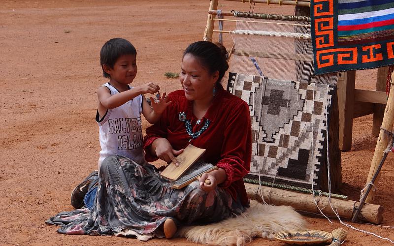 Navajo craftswoman and child